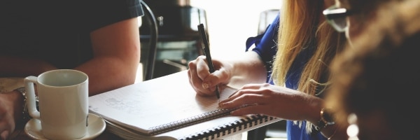 Manager reviewing employee documentation to support consistent HR practices and reduce risk